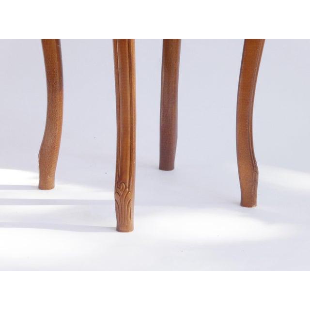 Beautiful French Louis XV style wooden stool with a fabric top with a floral design and stripes. The ottoman has nice...