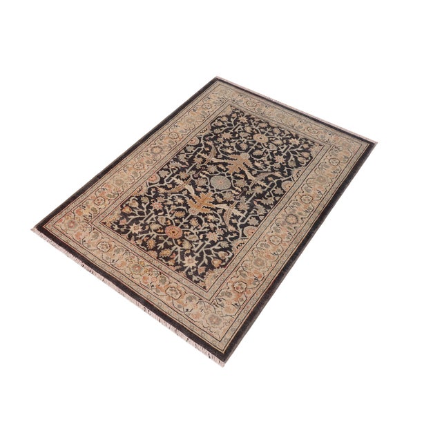 Enhance the ambiance of your home with this magnificent Persian-influenced Turkish hand-knotted rug made by skilled...