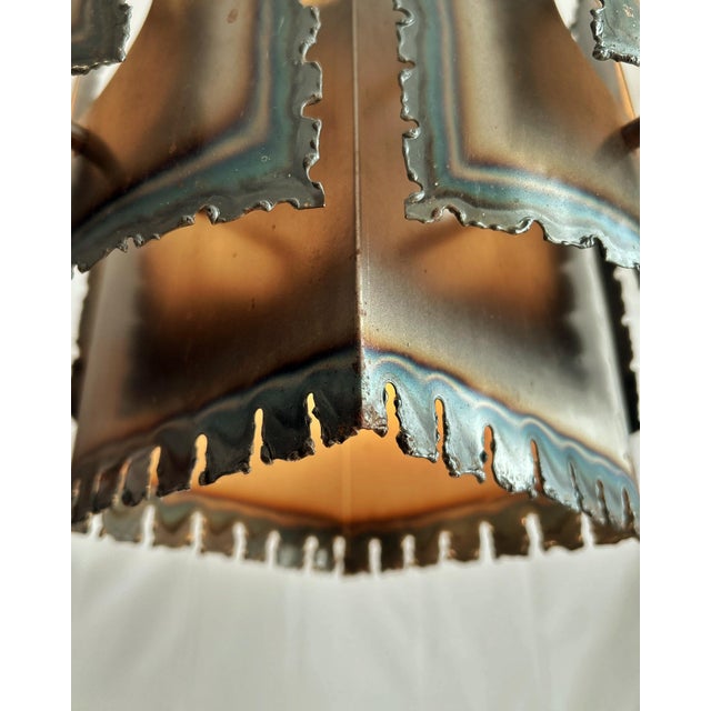 Designed by Danish lighting designer Svend Aage Holm Sørensen and produced in Denmark in the late 1960s, this pendant is...