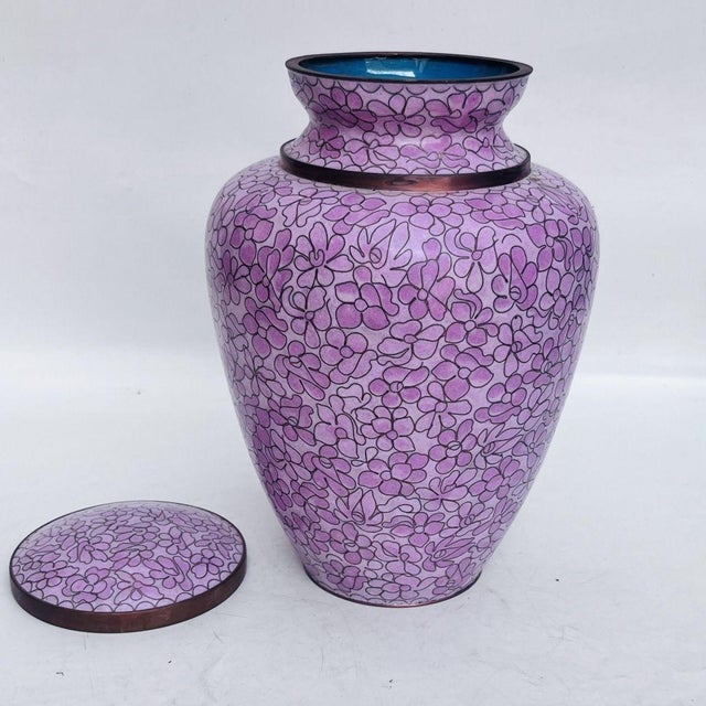 This substantial and elegant lidded jar is crafted in the traditional cloisonné enamel technique. The piece features a...