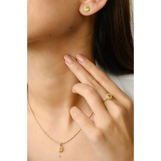 This is part of Chairish’s Fine Jewelry assortment. Yellow Sapphire and Diamond Halo Ring, Pendant and Earrings Jewelry...