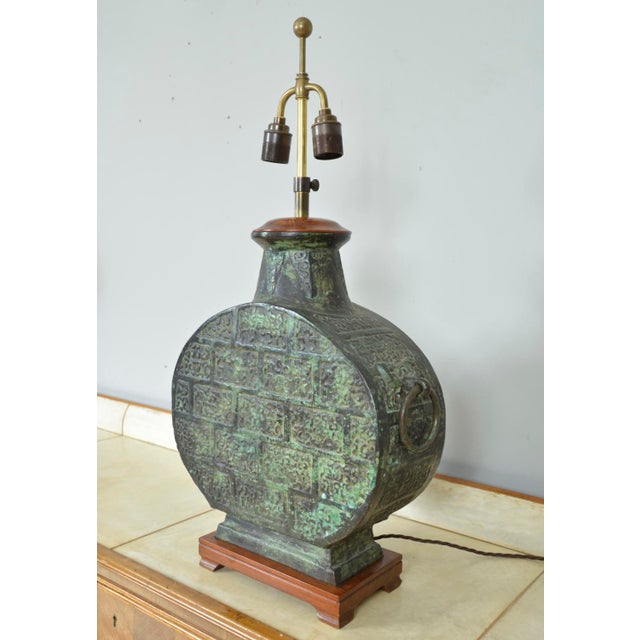 This highly decorative, solid bronze chinese moonflask in han dynasty style, has beautifully patinated to a deep verdigris...