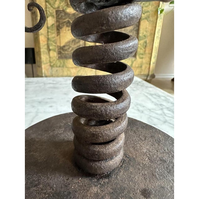 Discover the charm and historical significance of this rare 18th-century Iron Spiral Candle Holder, a unique artifact from...