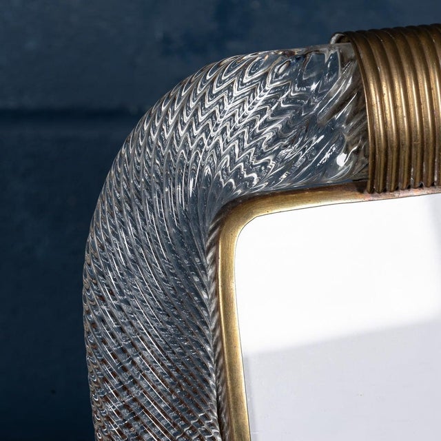 A beautiful glass mounted photograph frame attributable to the world renowned venini in venice, italy. The twisted glass...