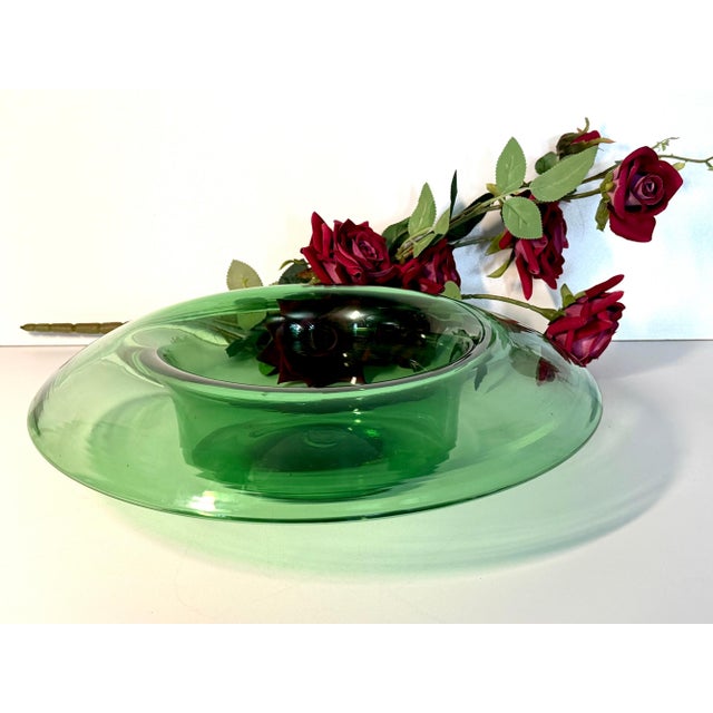 Made in Empoli, Italy, 1970s. It is a high-quality centerpiece made in green hand-blown and modeled glass. This is a...