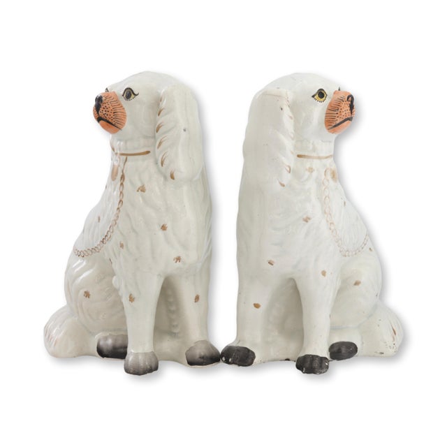 Mid 19th century English Staffordshire pottery King Charles spaniel dogs featuring traditional seated form with applied...