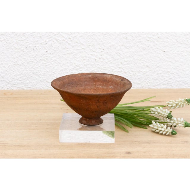 Invite a touch of ancient Americas artistry into your home with this captivating Pre-Columbian pottery bowl. Measuring 6...