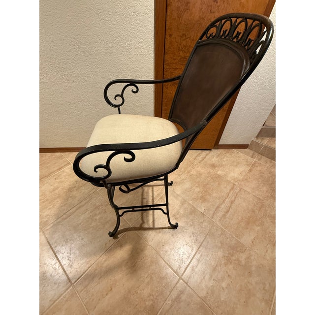 Purchased new in 2002, these Hooker Furniture swivel type bar stools consist of a decorative wrought iron base that is...