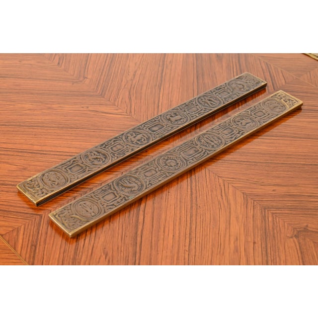 A gorgeous pair of Art Deco or Arts & Crafts period bronze blotter ends featuring symbols of the Zodiac By Tiffany Studios...