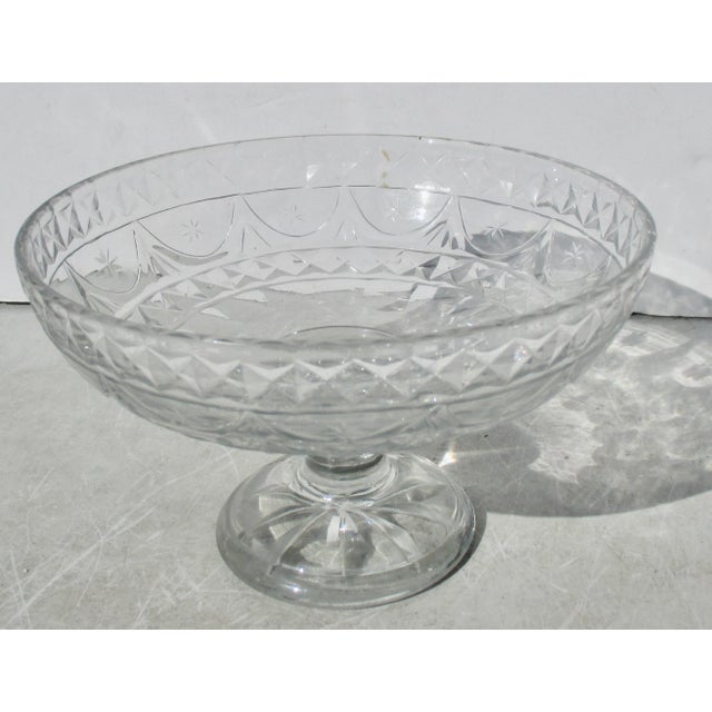 Heavy cut crystal Bowl from Irish maker. 18th century form with festoons and stars around the outer walls and standing on...