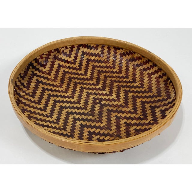 Vintage round woven rattan and split reed basket tray. Graphic display with two tone bowl and contrasting chunky natural...