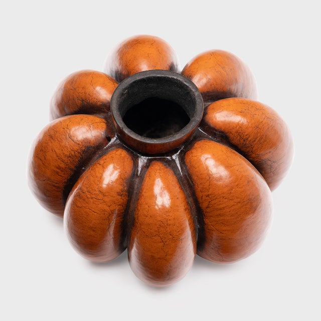 Sculptural and unusual, this elegant vessel is a 19th-century water jug made from constrained gourd with a rich patina....