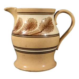 American Mocha Yellow Ware Jug With Puce Seaweed Decoration