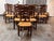 Design Plus Gallery presents a Set of Twelve Ladder-Back Dining Chairs from Collection Reproductions. The wooden frames...