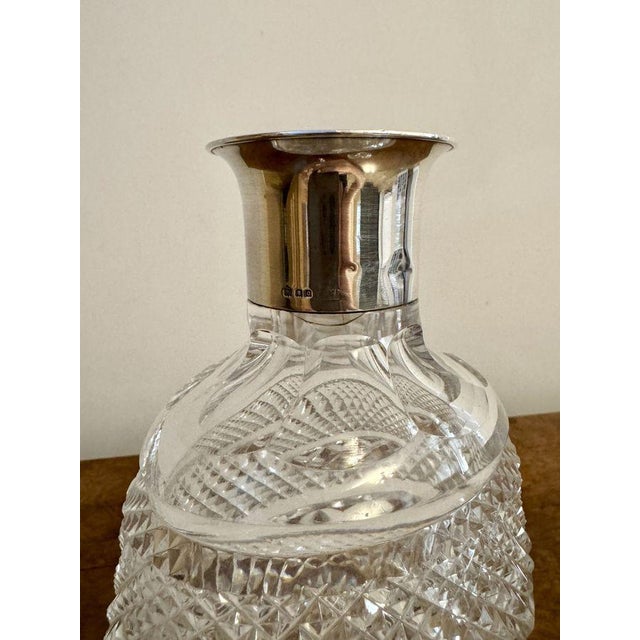 Quality antique Edwardian silver collar shaped decanter having a quality antique Edwardian silver hallmarked collar with a...