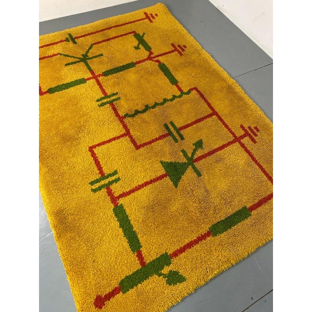 Modernist handmade wool rug Made in the 1930‘s. Yellow with green and red lines and figures. The rug is in very good...