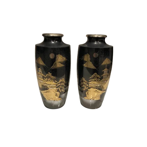 Two exquisite vintage Oriental bronze metal vases, each standing at a graceful 10 inches in height with a 4.5-inch width...
