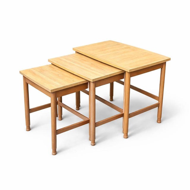 beautifully proportioned vintage Schreiber nest of tables, crafted in warm-toned teak and dating to the mid 20th century....