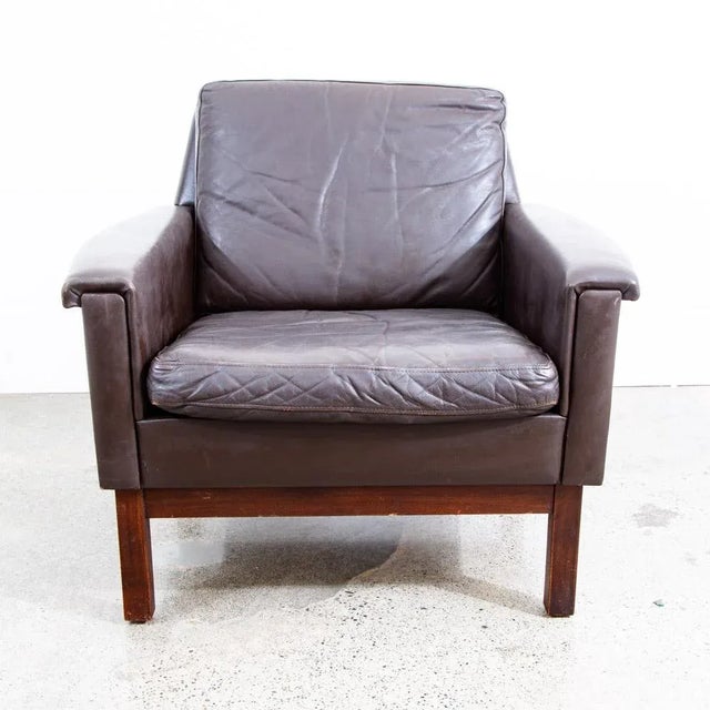 Very high quality Danish leather Lounge chair in supple and thick brown leather. This design is the classic Danish style...
