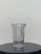 Late 20th century Tiffany & Co. cut crystal vase featuring a cylindrical body with vertical ribbed facets and a subtly...