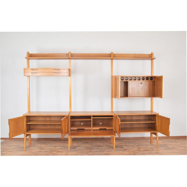 This three-pieces wall unit was designed in the 1960s by Norwegian designer Kjell Riise for Rival Brodrene Jatogs. This...
