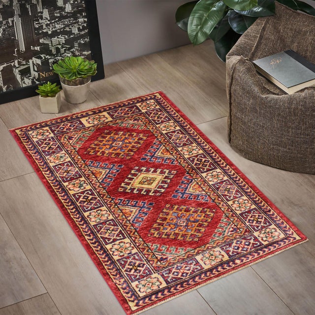 Enhance your home with this exquisite hand-knotted Super Kazak rug, crafted from fine hand-spun wool and dyed with all-...