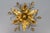 Gilt metal flower-shaped flush mount or wall lamp, the 1970s. Adorable Hollywood Regency style gilt metal flower-shaped...