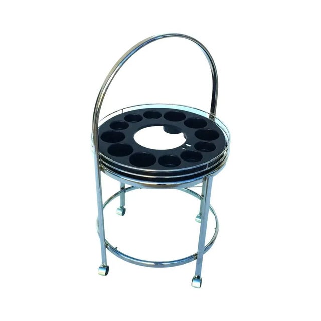 for your consideration is a 1970's chrome bar cart. Bar cart consists of a center bar caddy with a bottom shelf. Bar cart...