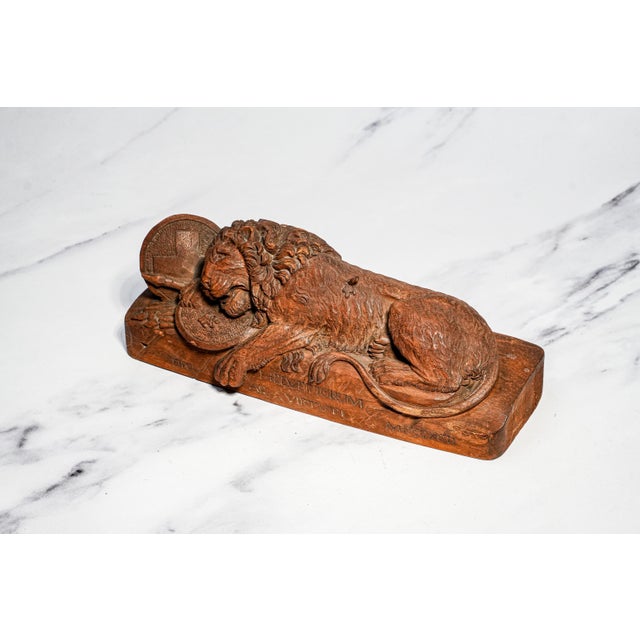 A remarkable and highly decorative mid-19th century Grand Tour carved wood souvenir depicting the legendary Lion of...