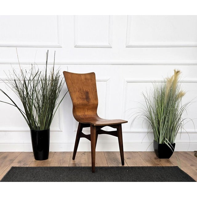 Very elegant and classic Mid-Century Modern Italian walnut wood chair. This chair will bring a touch of MCM craftsmanship...