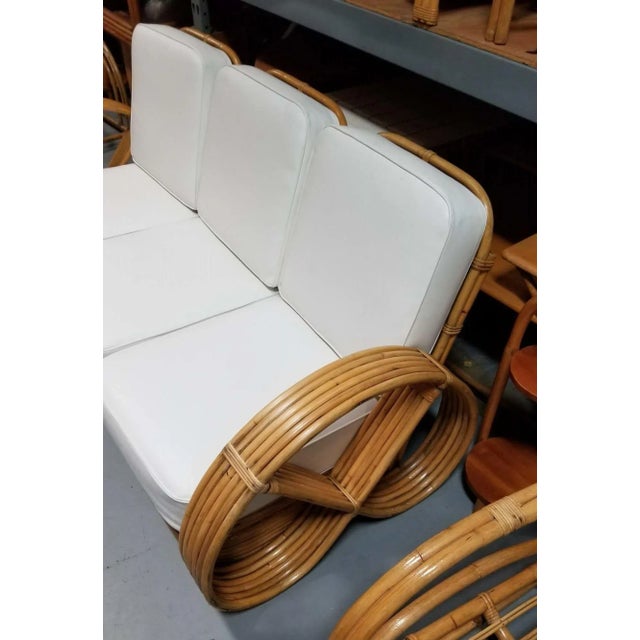 Restored Mid-Century Era Rattan 3-piece sofa with full pretzel six-strand arms sectional sofa with unique stacked rattan...