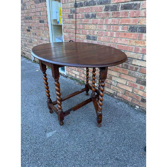 Gorgeous antique English barley twist table! The table is made from oak and has a lovely dark finish and beautiful patina....