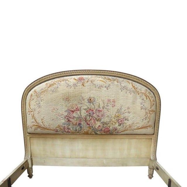 This is a pair of antique French Louis XV style twin bed frames, crafted from carved wood with a distressed finish. Each...