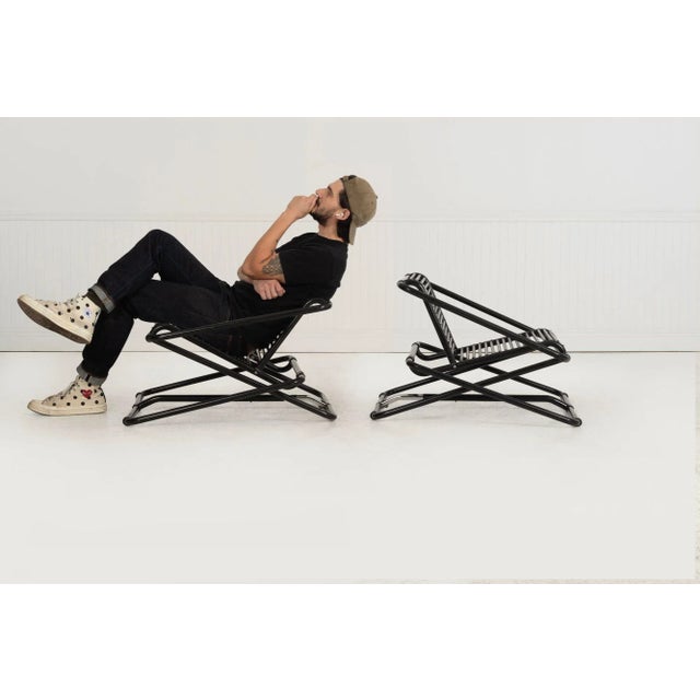 Ron Arad Pair of Rocking Chairs for One-Off, United Kingdom, 1981 Adjustable rocking chairs constructed of black-enameled...