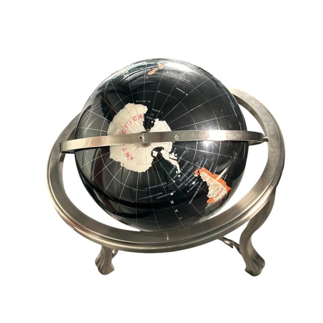 This is an incredibly detailed and luxurious handcrafted gemstone globe. The use of black onyx, alongside more than 30...