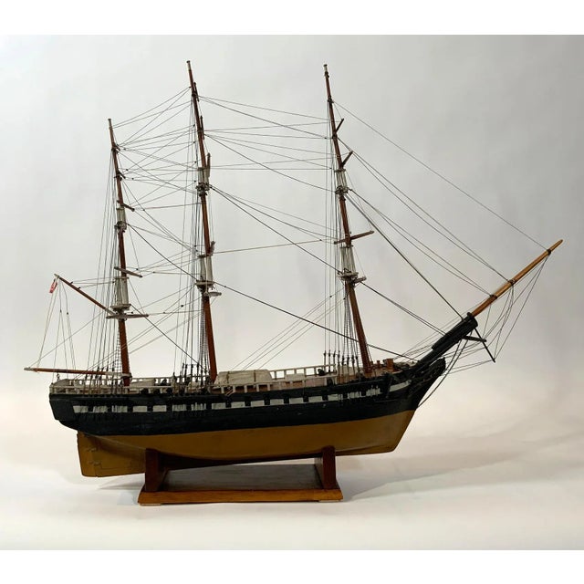 Antique ship model of an American warship. Scribed deck, cabins, hatches, companion way, etc. The model is rigged with...