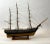 Antique ship model of an American warship. Scribed deck, cabins, hatches, companion way, etc. The model is rigged with...