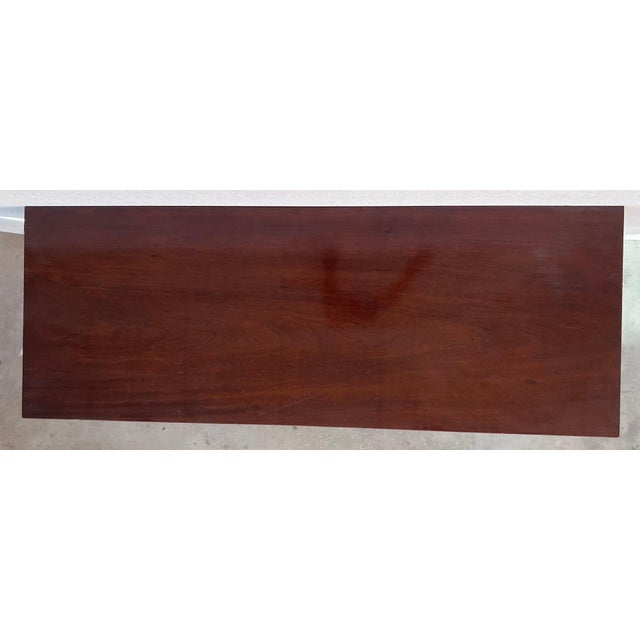 Handsome 19th century Empire style console in walnut adorned with ebonized column legs and rectangular base, Vienna, circa...