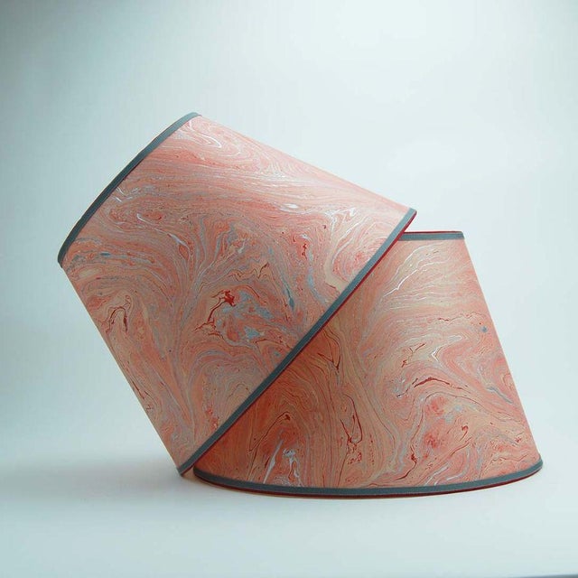 Marbled paper with red, silver and salmon; trimmed in two colors of grosgrain. Available in 3 sizes: 8” x 12” x 8.75” 9” x...