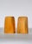 A pair of mid-century teak bookends with a strongly sculptural form. Simple and architectural in warm-toned lacquered teak...