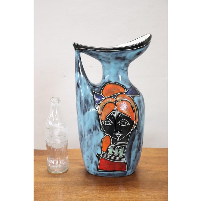 Here is a stunning Italian carafe vase from the 1960s, displaying a unique and futuristic design that is sure to catch the...