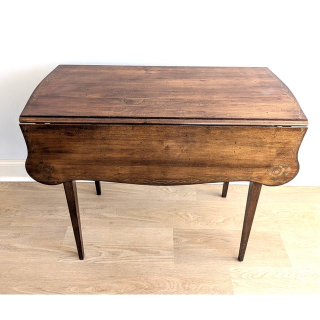 This beautiful Hitchcock drop-leaf dining table is estimated to be from Mid 20th Century (60s or 70s) when the Early...