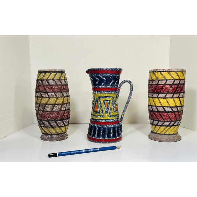 Group of 1950’s Italian vessels in a dynamic geometric pattern. The glaze has the rough natural feel of lava. Brilliantly...