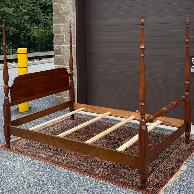 A vintage Pennsylvania House Traditional solid cherry full size four poster bed. American made. Circa 1970s. Measures...