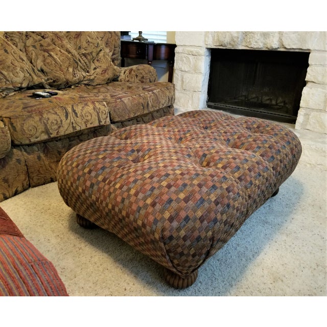 - Large, high quality custom upholstered ottoman - Geometric pattern - Solid wood turned legs - Excellent condition