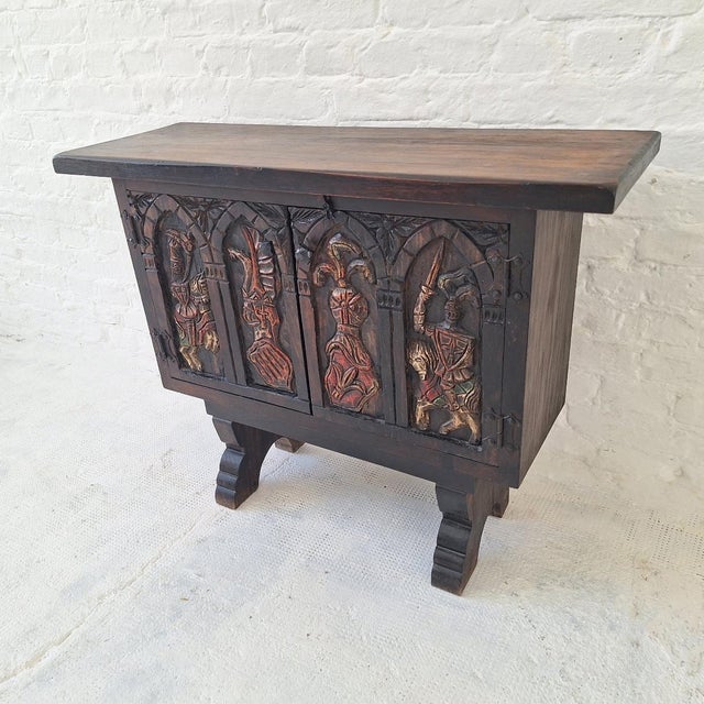 Spanish colonial revival console / sideboard with four hand-carved and painted knights on horseback. Constructed from...