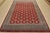 A tribal Bokhara Jaldar rug hand-knotted with fine wool on a cotton foundation. This rug features rows of repeating...