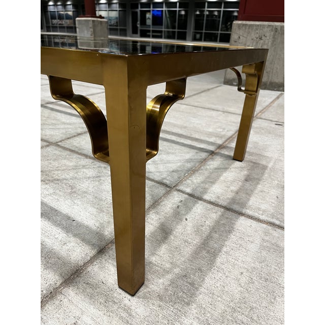 Chinese Chippendale brass and glass coffee table with fretwork from mastercraft, circa 1970s.