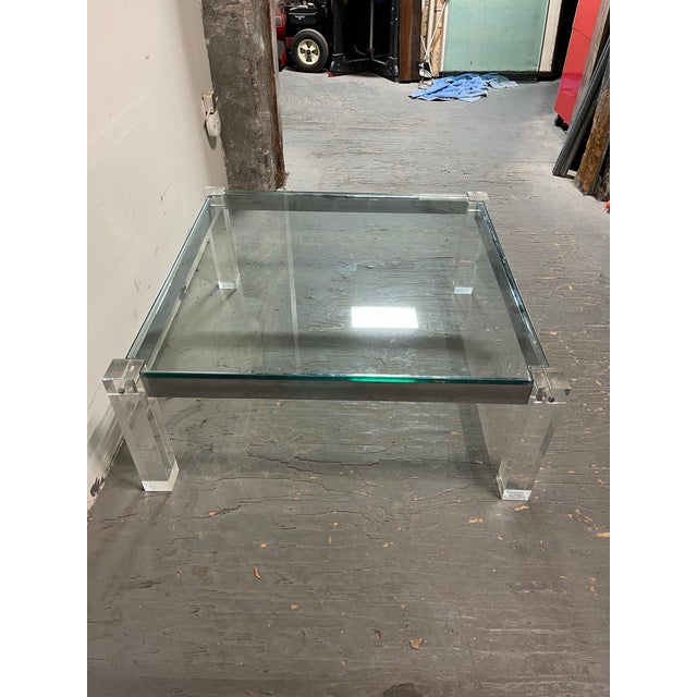 Experience the pinnacle of 1970s Hollywood Regency glam with this architectural Mid-Century Modern coffee table. Designed...