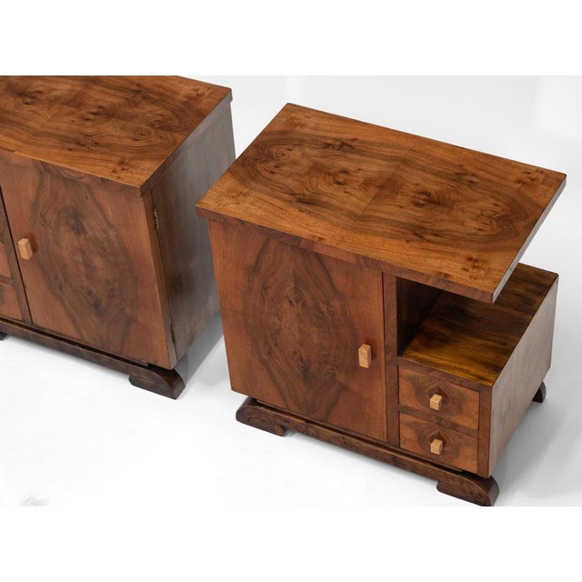 Pair of Art Deco walnut bedside cabinets. Circa 1930. Showing classic bold geometric lines and symmetrical design,...
